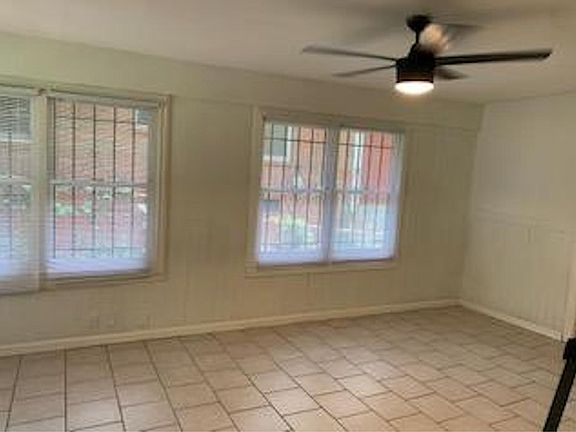 Finished in carport is great for a home office, workout room, sunroom...