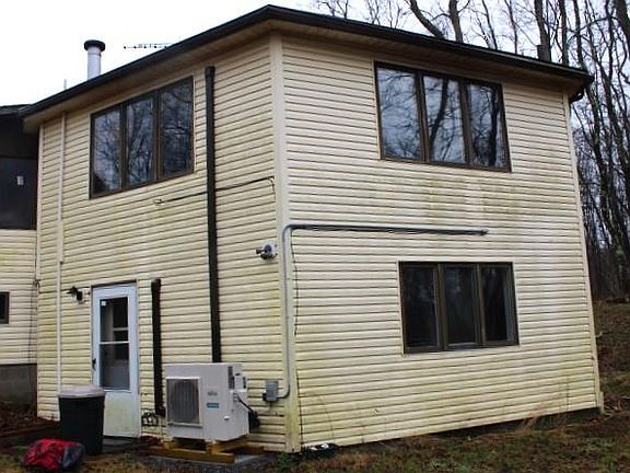 Lower apartment window facing over the hill. Great room is on upper level.