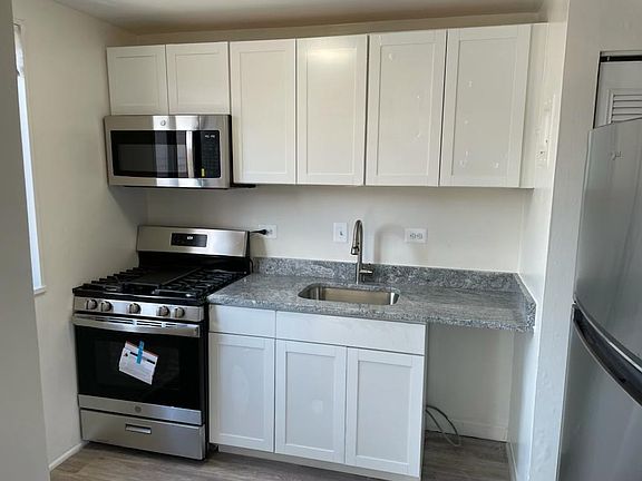 Updated kitchen with new appliances and granite countertop