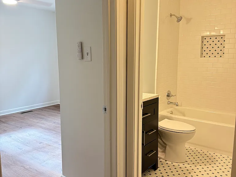 Hallway to bathroom and bedroom 1.