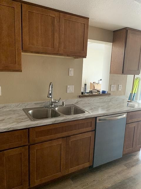 Kitchen remodel. All new cabinets, countertops, sink, faucet, garbage disposal, and dishwasher.