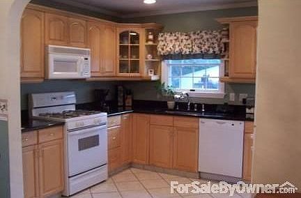 Kitchen : Large open kitchen with tile floors, granite countertops and new cabinets.