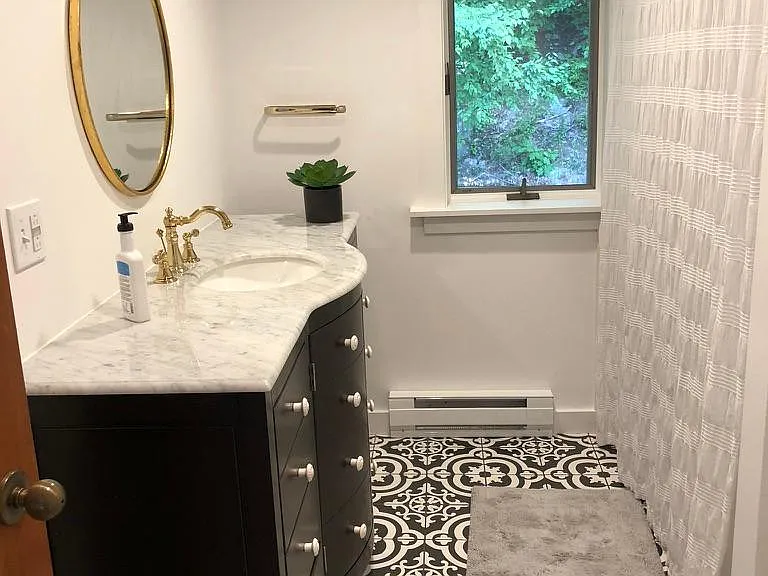 Full bathroom of second master suite