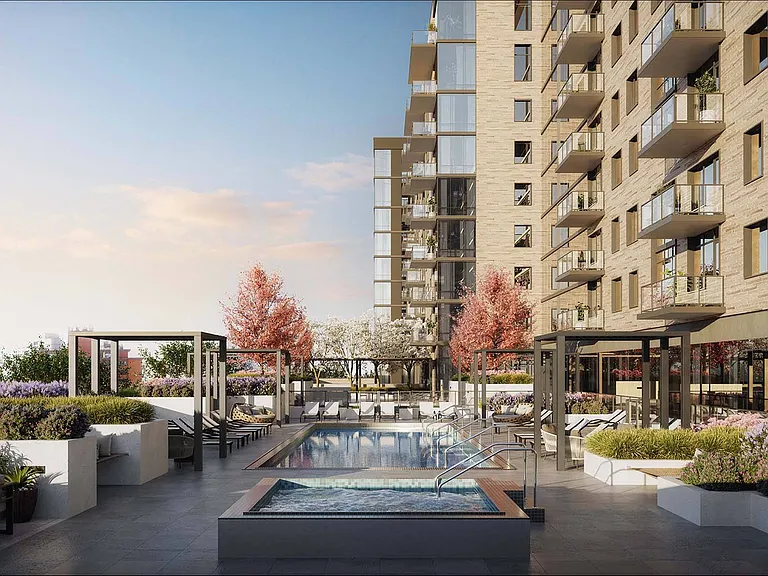 Dive into relaxation on the outdoor pool and hot tub patio, surrounded by lush plants, creating a tranquil escape just outside your door.