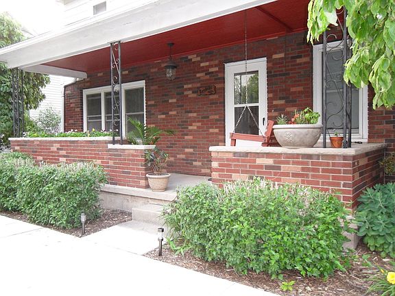 Front of house, established bushes, flower, inset flower boxes