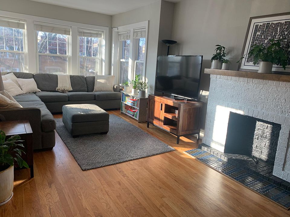 Large, sun-drenched living room overlooking Bell Avenue. Can be used as both a living room and a playroom given its size.
