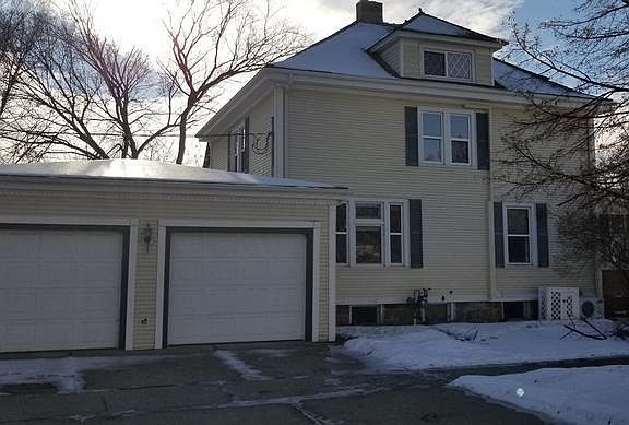 side view of property showing garages