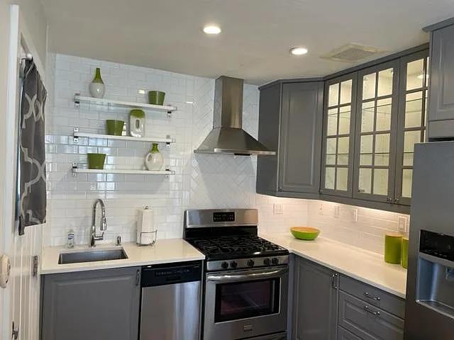 Ample Cabinet space with all pots/pans, dishware and flatware.