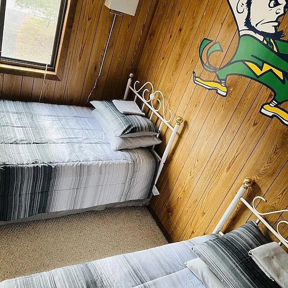 upstairs bedroom with two beds