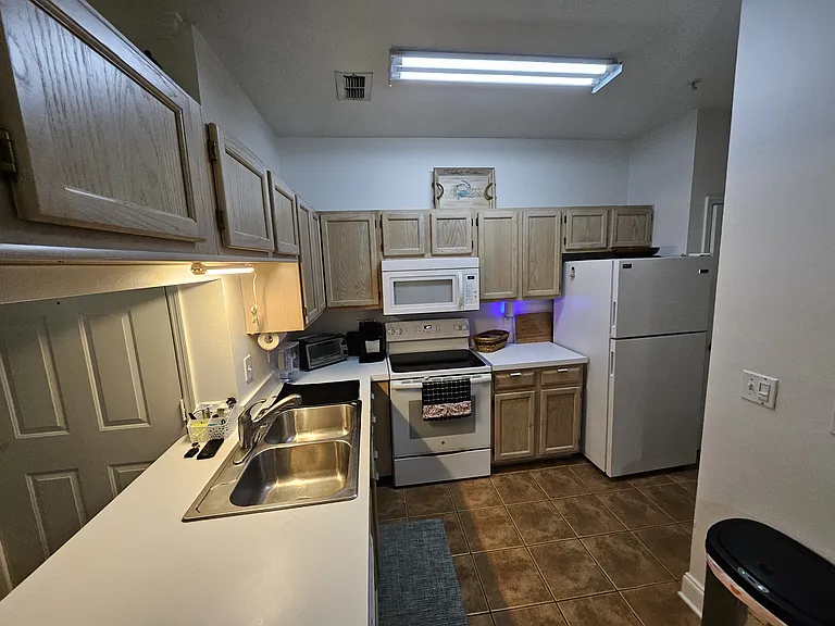 fully equipped kitchen with dishwasher, microwave, oven, refrigerator, coffee maker etc.