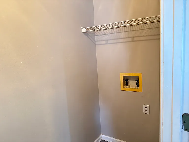 Convenient washer and dryer hookups inside the separate utility closet space.
