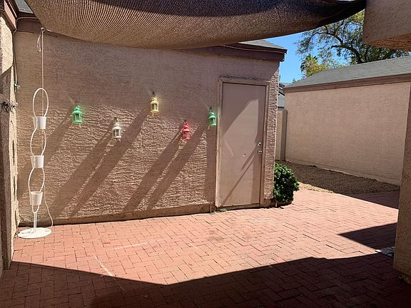 Private, partially shaded courtyard with access single car private garage.
