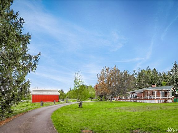 Home sits well off the road on a paved driveway