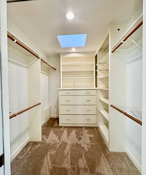 Primary bedroom walk-in closet
