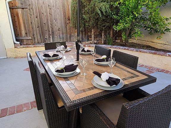 Imagine yourself with a glass in your hand, laughter and great conversation around this very large table in a very large private back patio.