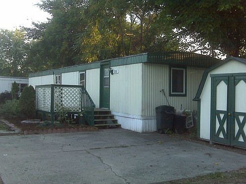 View of home from curve on road in park