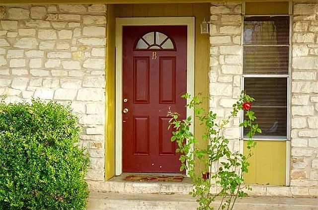 Front door to Unit B with beautiful rose bush!