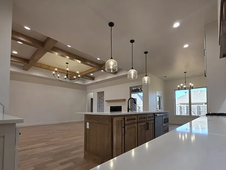 Open concept living with plenty of lighting