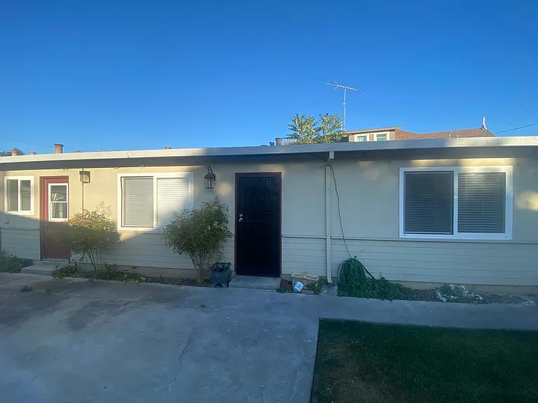 Front door/entrance with screen door.