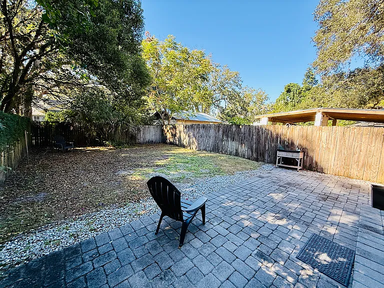 Big Fence in Back Yard house paved all around