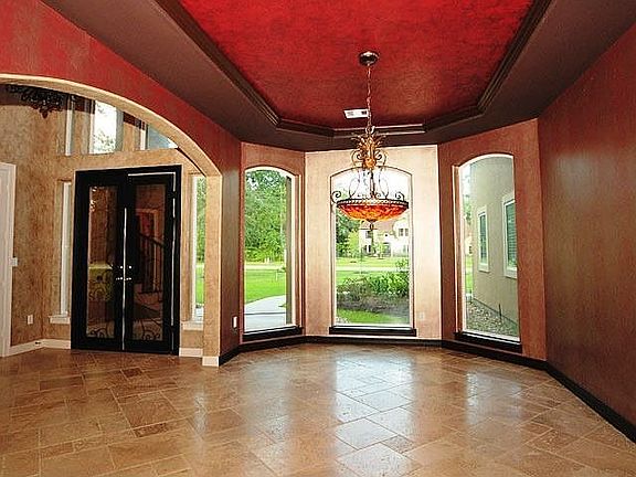 View of the formal dining room with lighting featured in the tray ceiling.