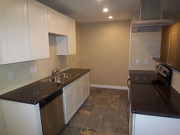 Kitchen has been beautifully upgraded with granite counter tops, slate flooring, new appliances, and