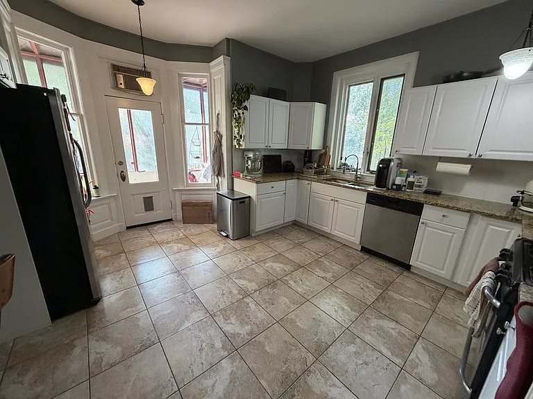 Large kitchen. Lots of room for a center island. The private outdoor deck is through the far door and to the left.