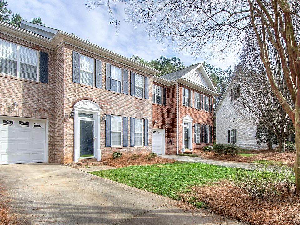Front of the home boats over-sized 2 car driveway plus one car garage