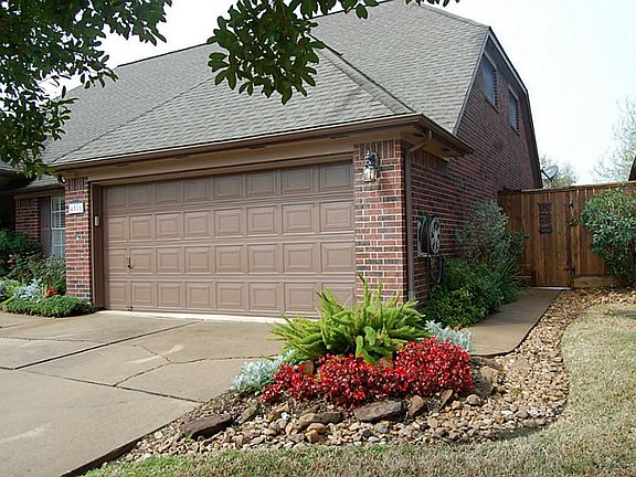 Well manicured home inside and out. Concrete sidewalk from front driveway around the side of the hou