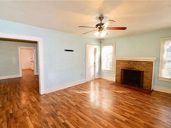 The Living Area connects to the Formal Dining Room.