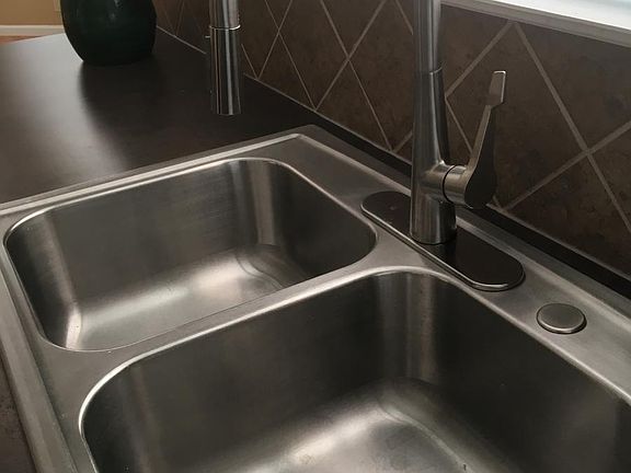 Kitchen goose-neck faucet with pull down sprayer