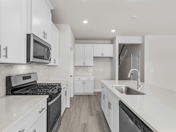 The well-appointed kitchen features plenty of counter space to make meal prep a breeze.