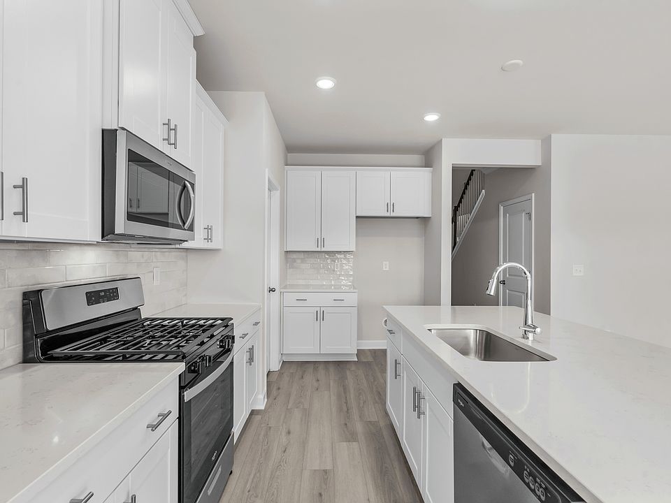 The well-appointed kitchen features plenty of counter space to make meal prep a breeze.