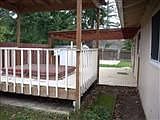 covered patio and hot tub