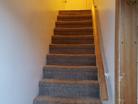 Entrance and Stairs up to apartment