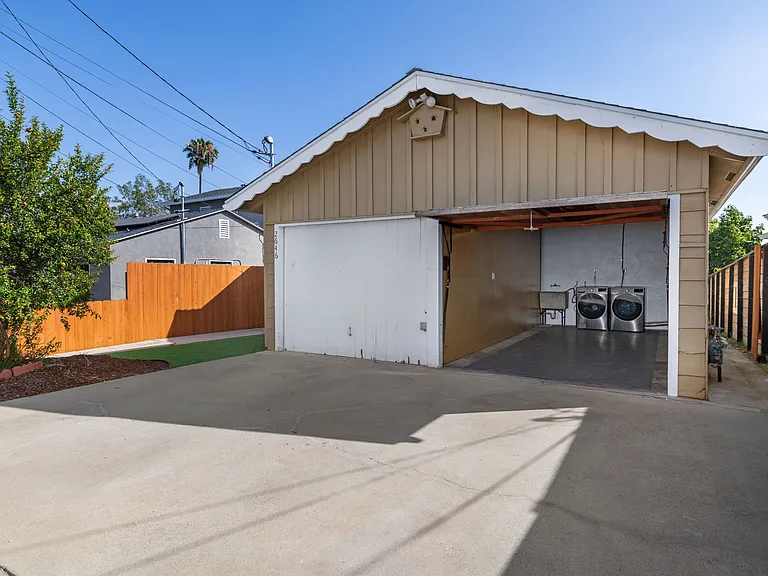 Enjoy the ultimate convenience of a large, private garage, complete with an additional dedicated parking spot in the driveway.