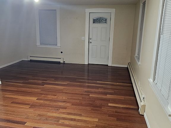 Spacios Living roo with hardwood floors.