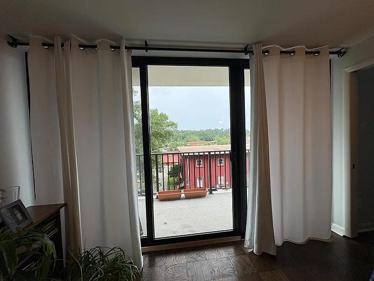 Updated balcony doors (curtains included).
