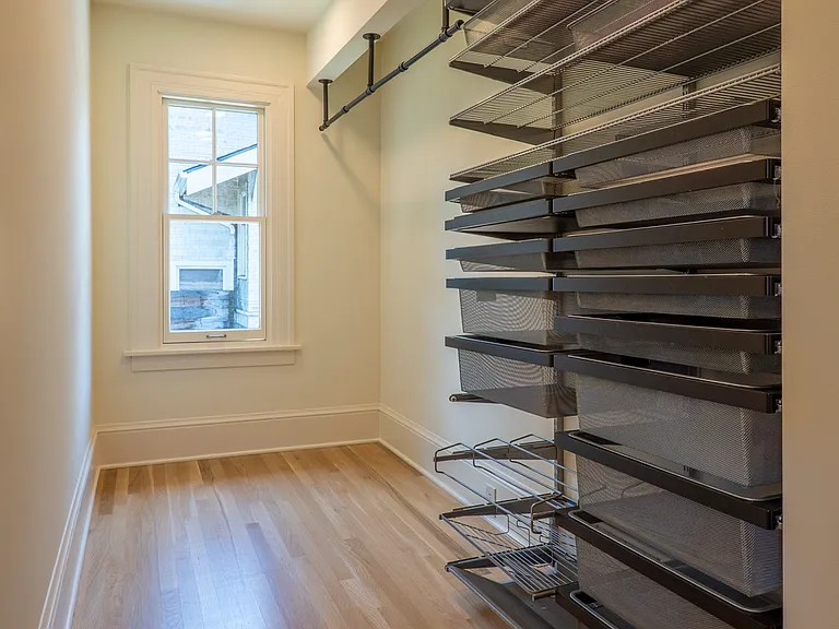 Walk-in master closet, partial view.