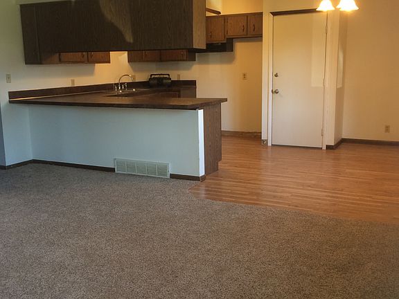 Living room looking towards kitchen new carpet & new plank f