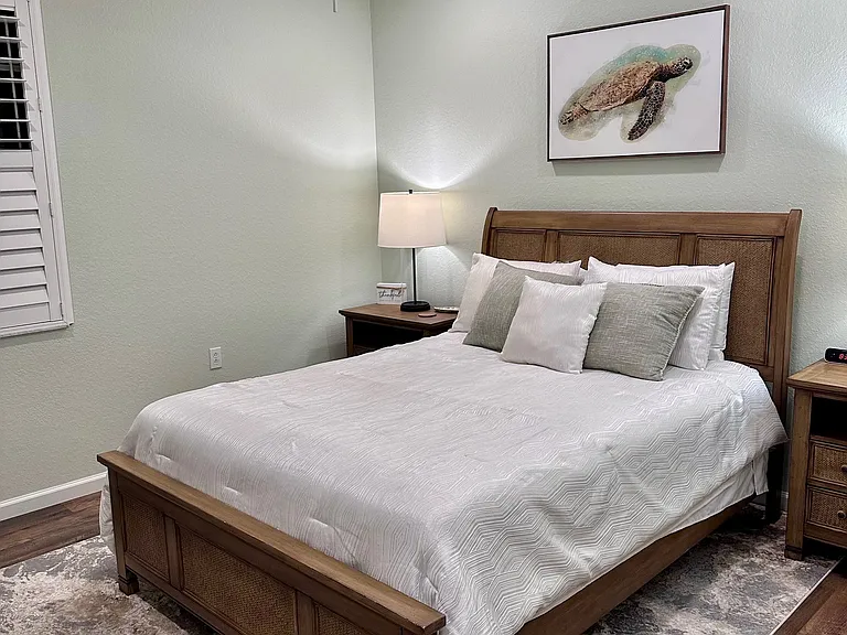 Newly remodeled secondary bedroom with queen bed.