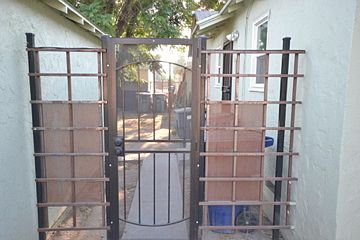 Back entrance from private driveway. Private backyard.