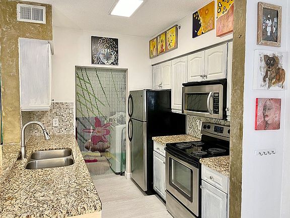 5th image of 19877 E Country Club Dr APT 105
