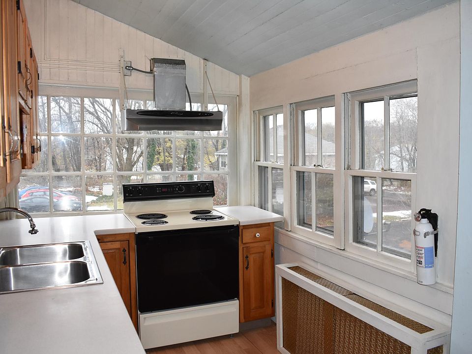 Charming south and east facing kitchen. Corian countertops.