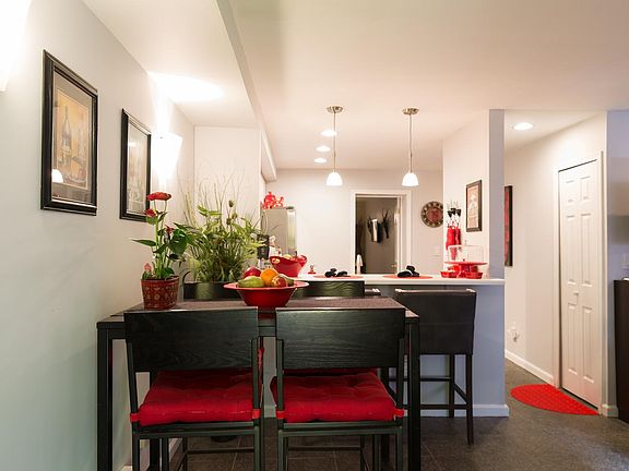 Dining area looking into snack bar with leather bar stools- 