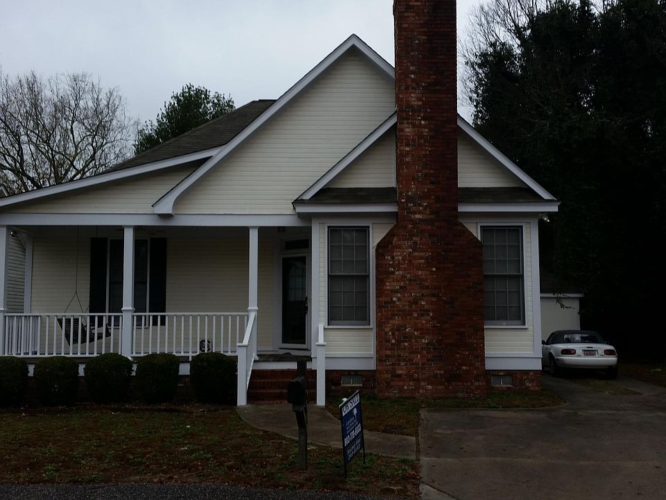 Front of house with porch.