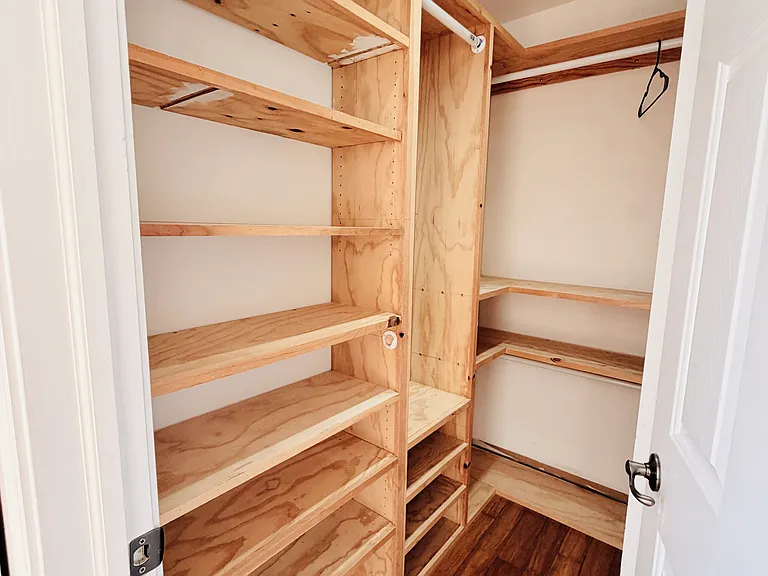 Primary bedroom walk in closet
