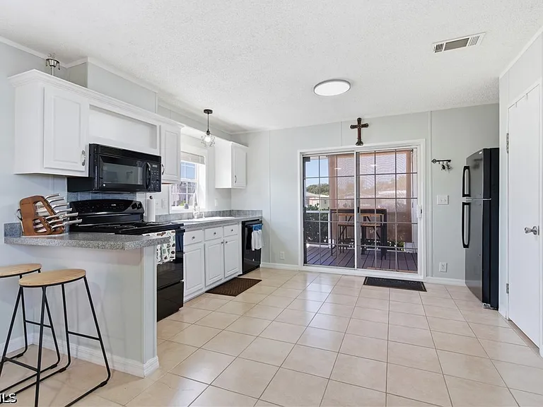 5558 Palm Beach Blvd #105 — Photo 2