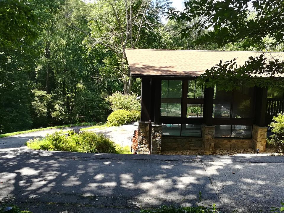 View of the house from tennis court on top of the hill.