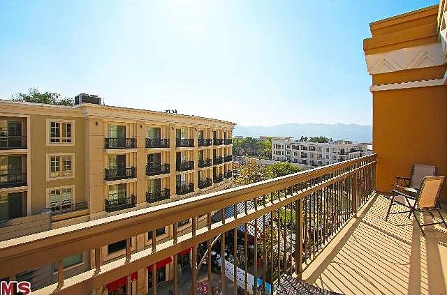 Private balcony spans the length of the loft with